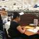 A SWOP Sacramento volunteer helping a client with a clothing voucher.